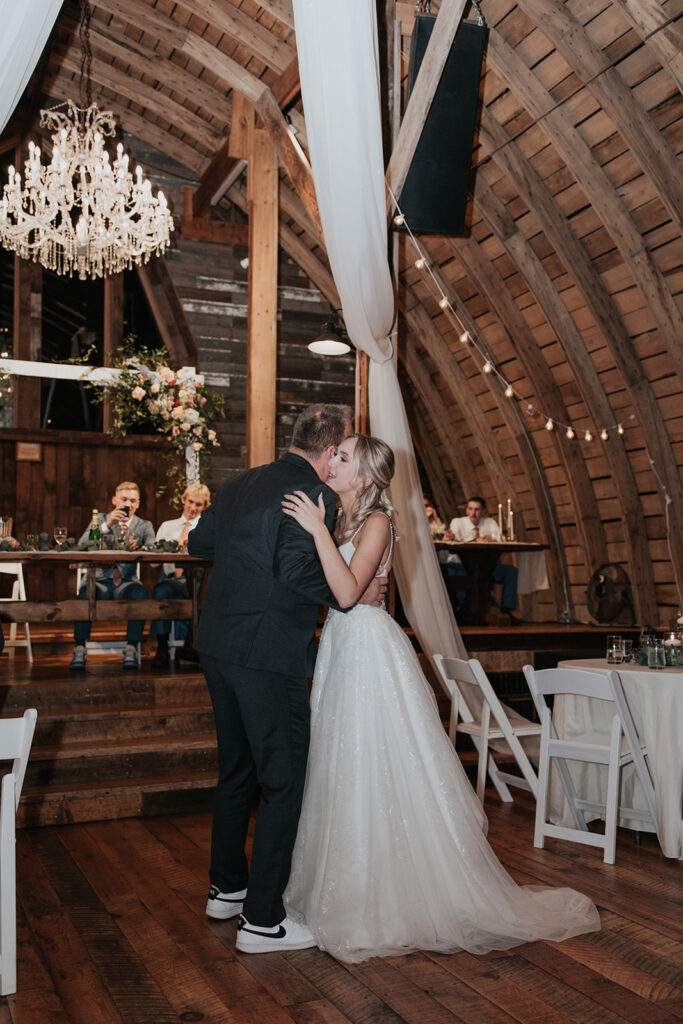 bride and father dance in stone hill barn