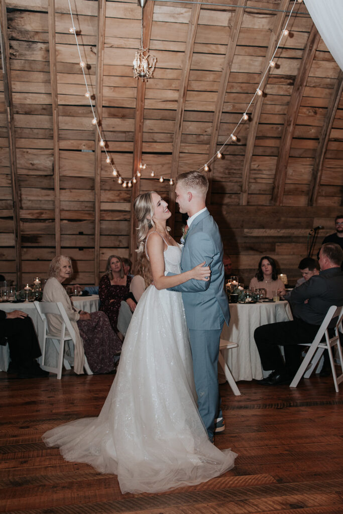 bride and groom first dance in stone hill barn
