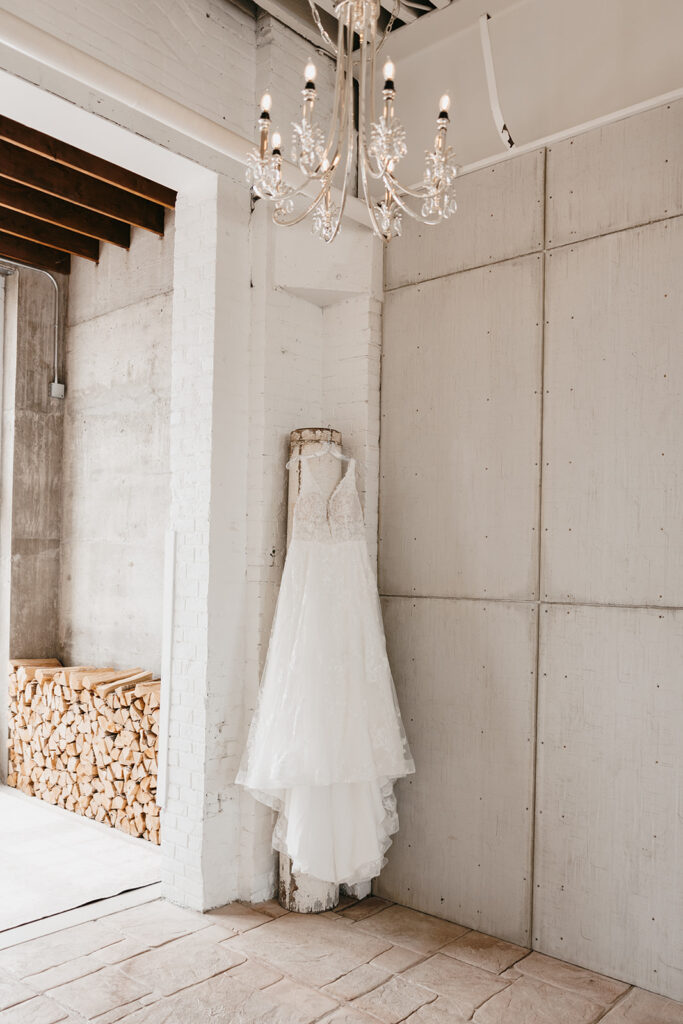 brides dress hanging in the bridal suite