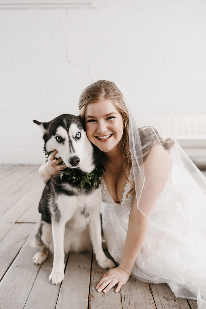 bride with her dog in the bridal suite
