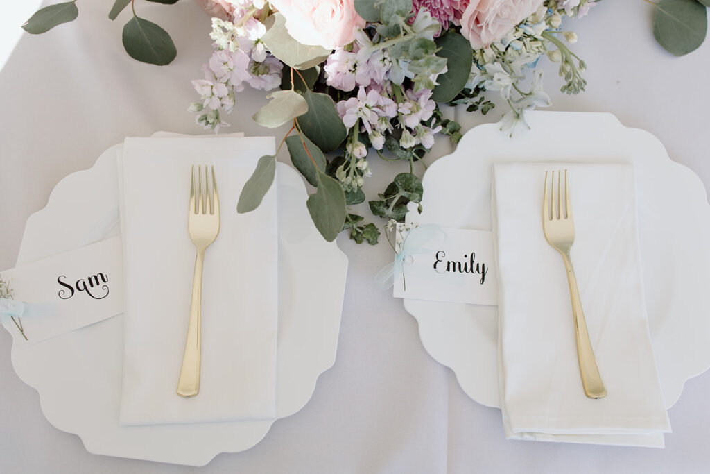 bride and groom wedding table setting