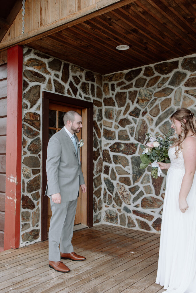 bride and groom first look during their Airbnb small wedding