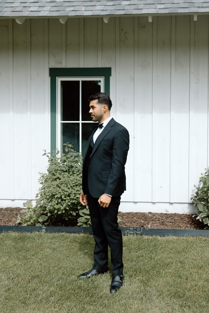 Groom waiting for bride for first look