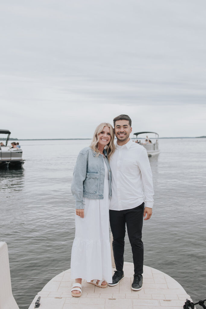 Bride and groom standing on the dock