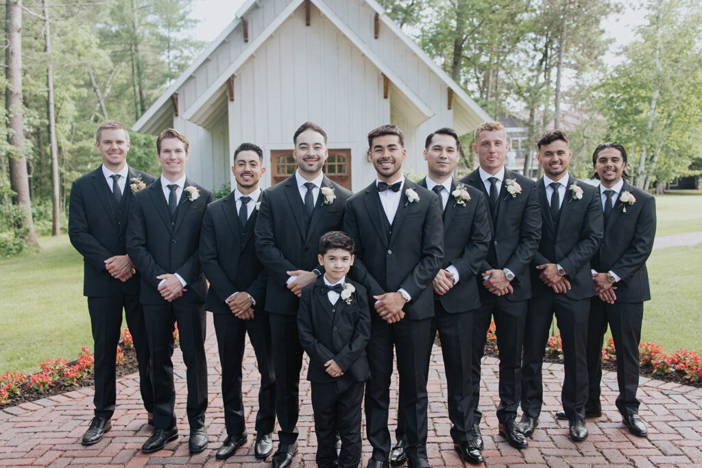 groomsmen standing in front of the Grand View Lodge chapel