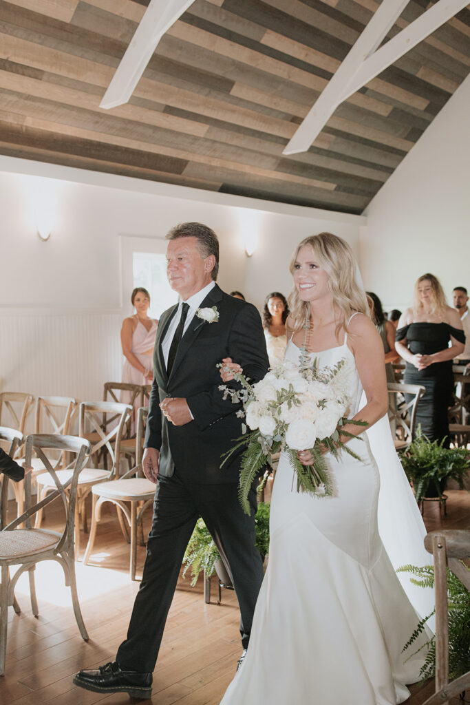 Bride and father walking down the aisle