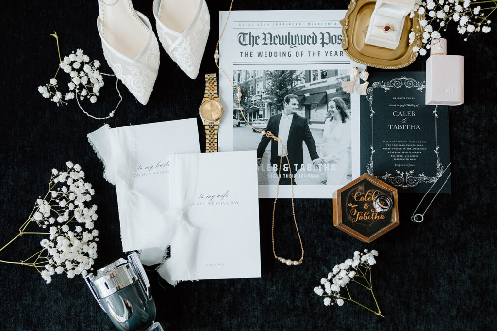 Luxe wedding flat lay with newlywed newspaper