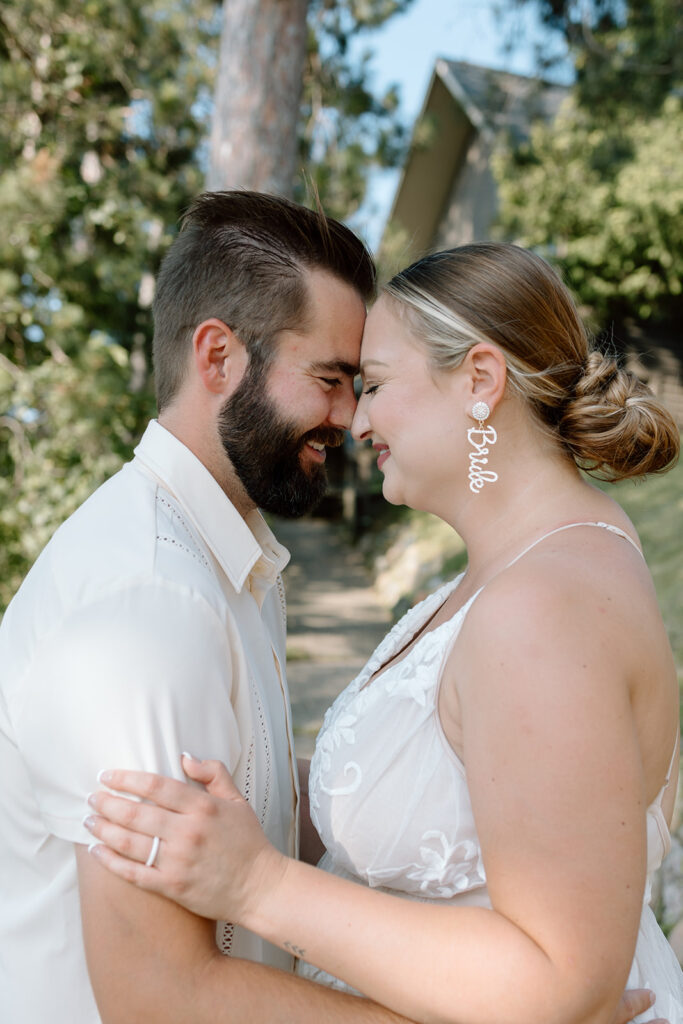 Bride and groom photos on the lawn at Madden's on Gull Lake