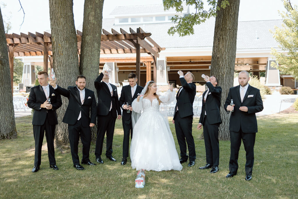 Bride and groomsmen drinking Smirnoff Ices