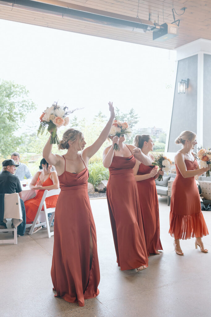 Bridesmaids grand entrance to wedding reception