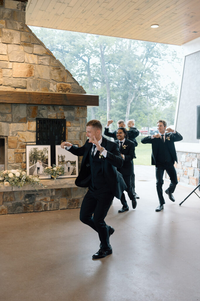 Groomsmen grand entrance to wedding reception