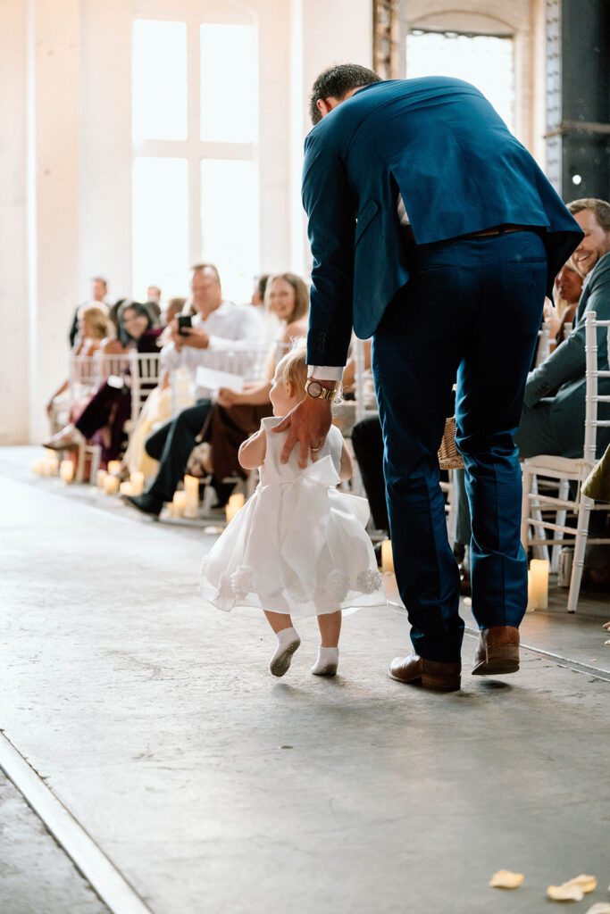 Elegant wedding ceremony setup inside The Northern Pacific Center with candles and florals
