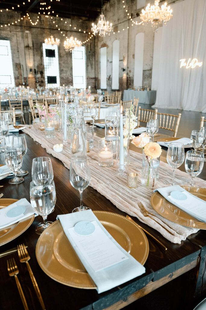Elegant wedding reception setup inside The Northern Pacific Center with candles and florals

