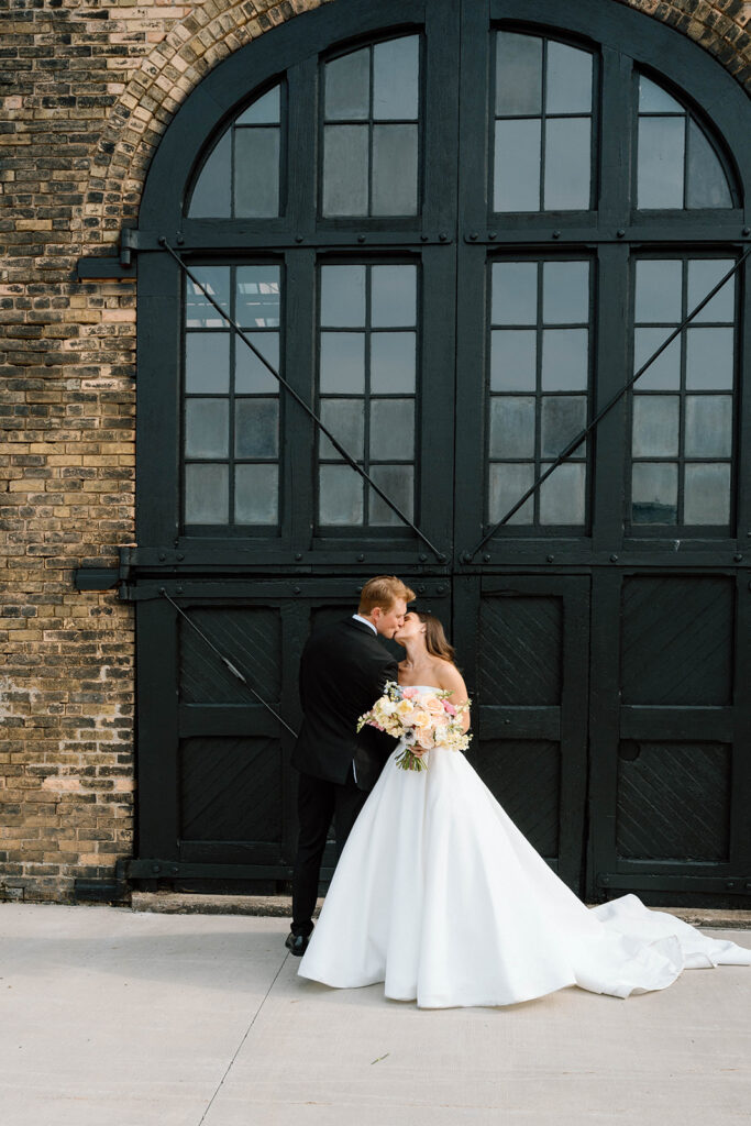 Bride and groom posing for timeless wedding portraits
