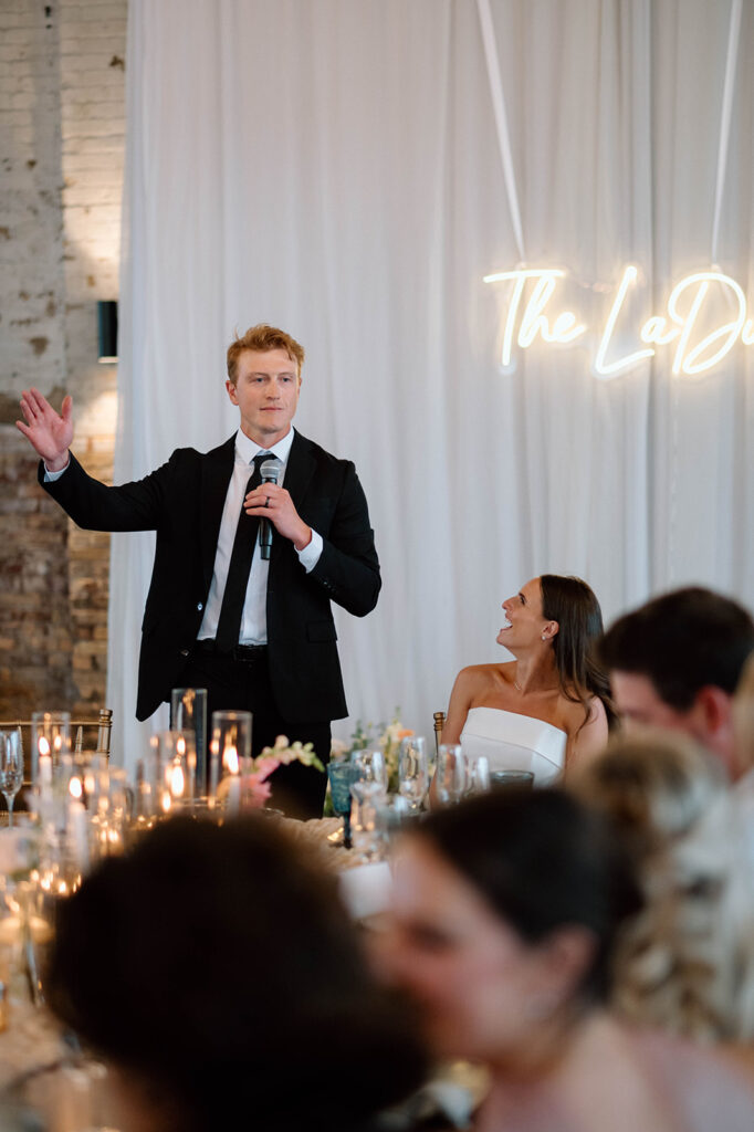 Elegant wedding reception setup inside The Northern Pacific Center with candles and florals

