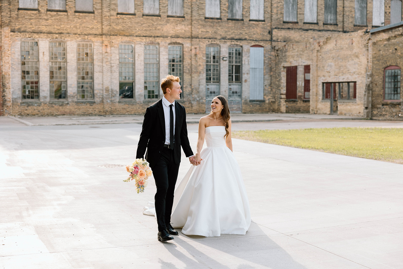Bride and groom posing for timeless wedding portraits