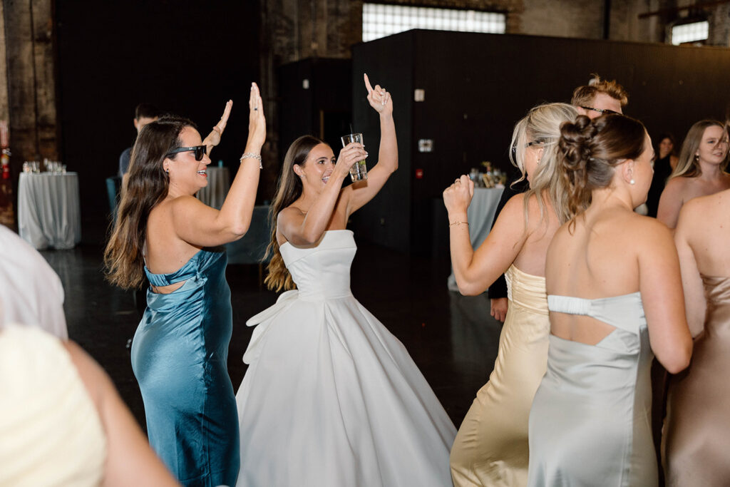 Guests dancing and celebrating during the lively wedding reception
