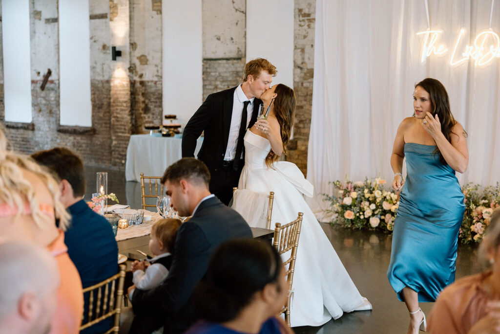 Guests dancing and celebrating during the lively wedding reception

