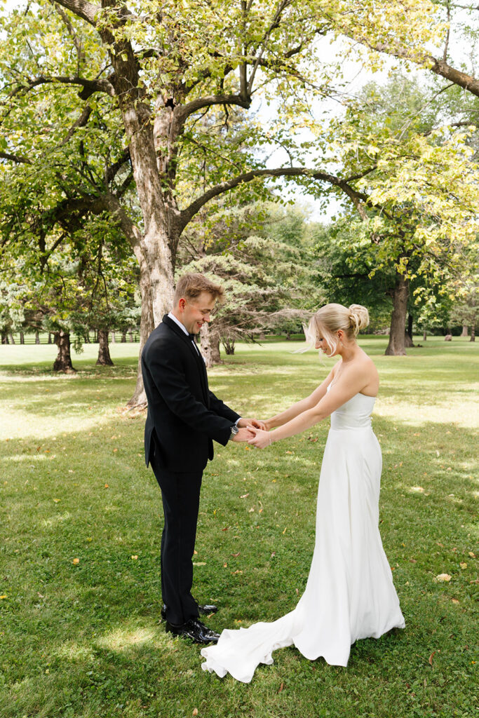 Bride and groom sharing their first look at a private estate wedding in North Dakota
