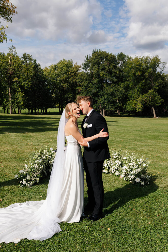 Elegant outdoor ceremony surrounded by golden sunlight and open landscape
