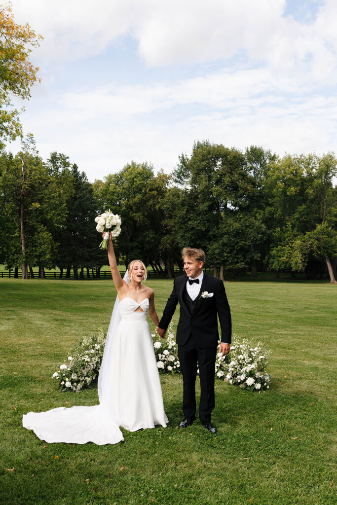 Elegant outdoor ceremony surrounded by golden sunlight and open landscape
