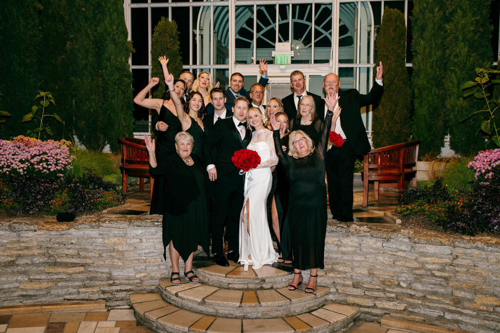 Candid photo taken during a cozy ceremony at a botanical space.
