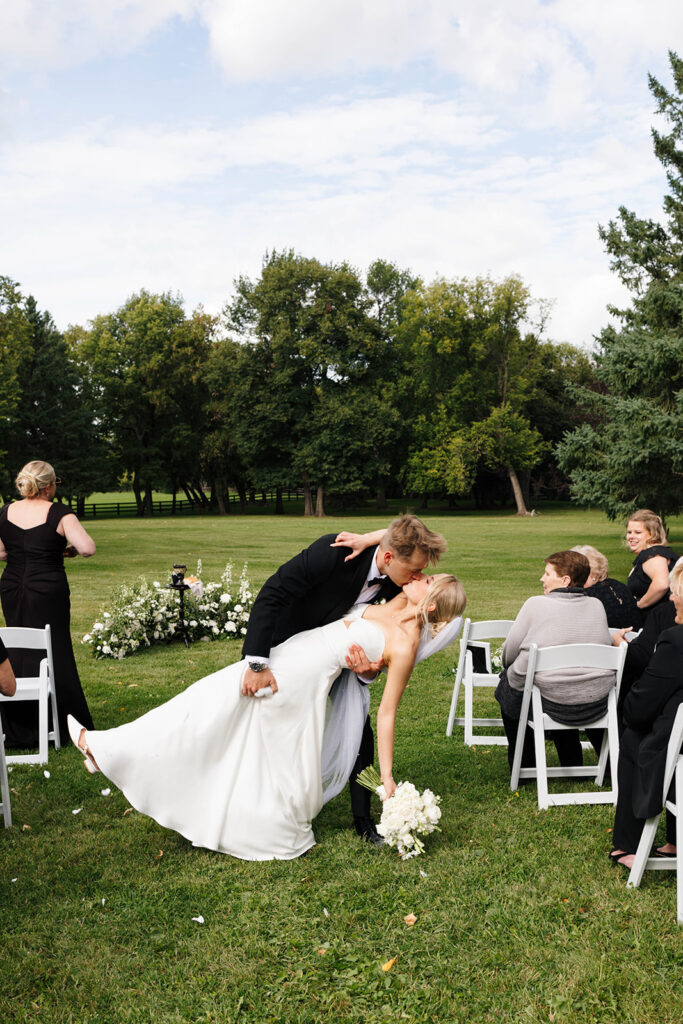 Elegant outdoor ceremony surrounded by golden sunlight and open landscape
