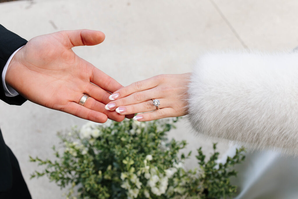 Bride and groom dancing under string lights at their reception