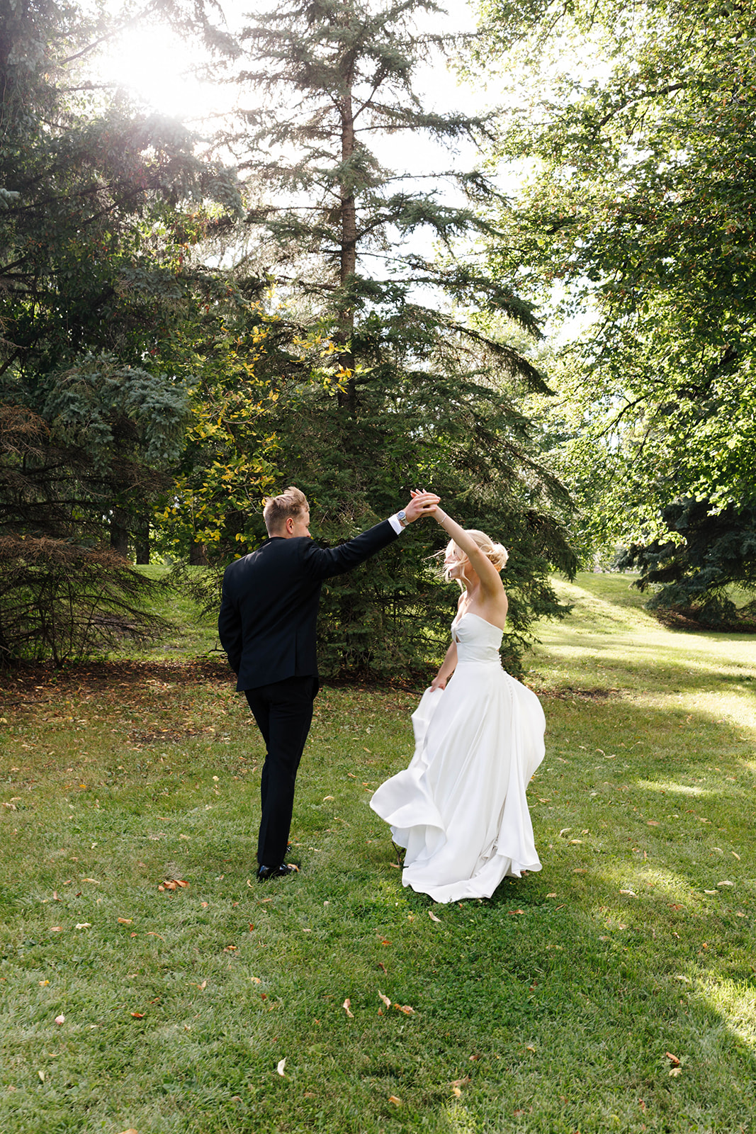 Bride’s dress blowing in the wind during romantic couple portraits
