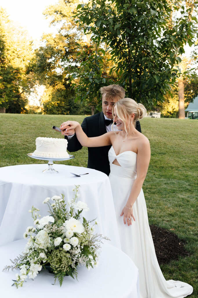 bride and groom doing a cake cutting
