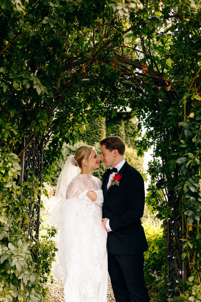 Candid photo taken during a cozy ceremony at a botanical space.
