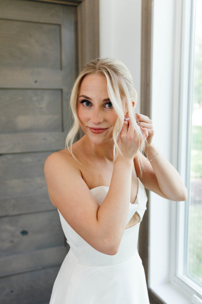 Bride getting ready with hair and makeup by Avant Hair and Skin Care Studio
