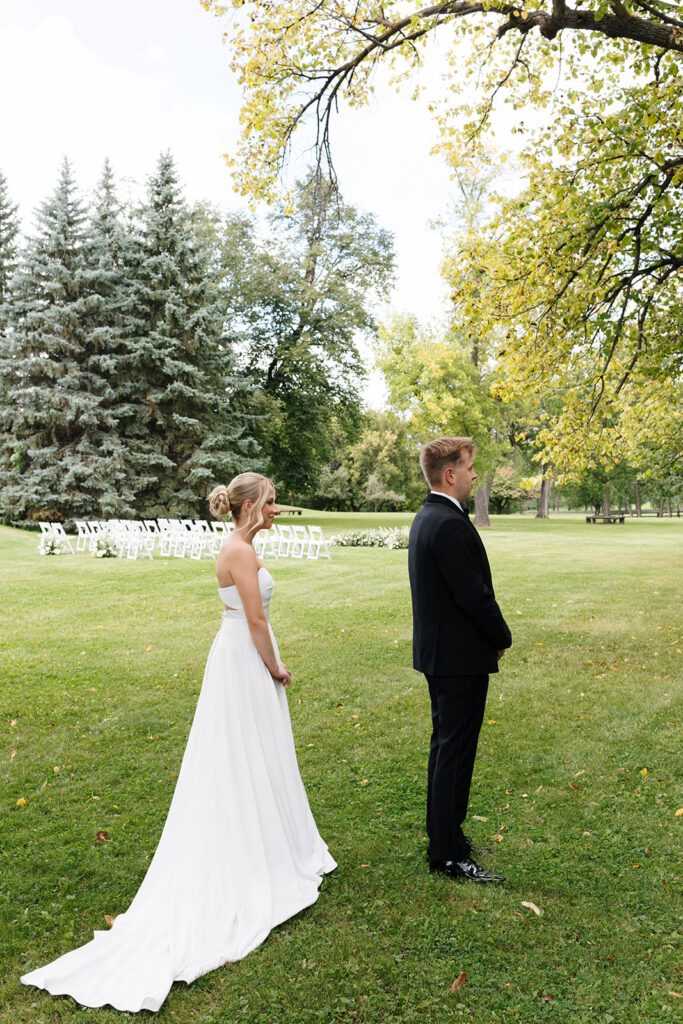Bride and groom sharing their first look at a private estate wedding in North Dakota
