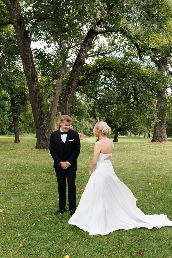 Bride and groom sharing their first look at a private estate wedding in North Dakota

