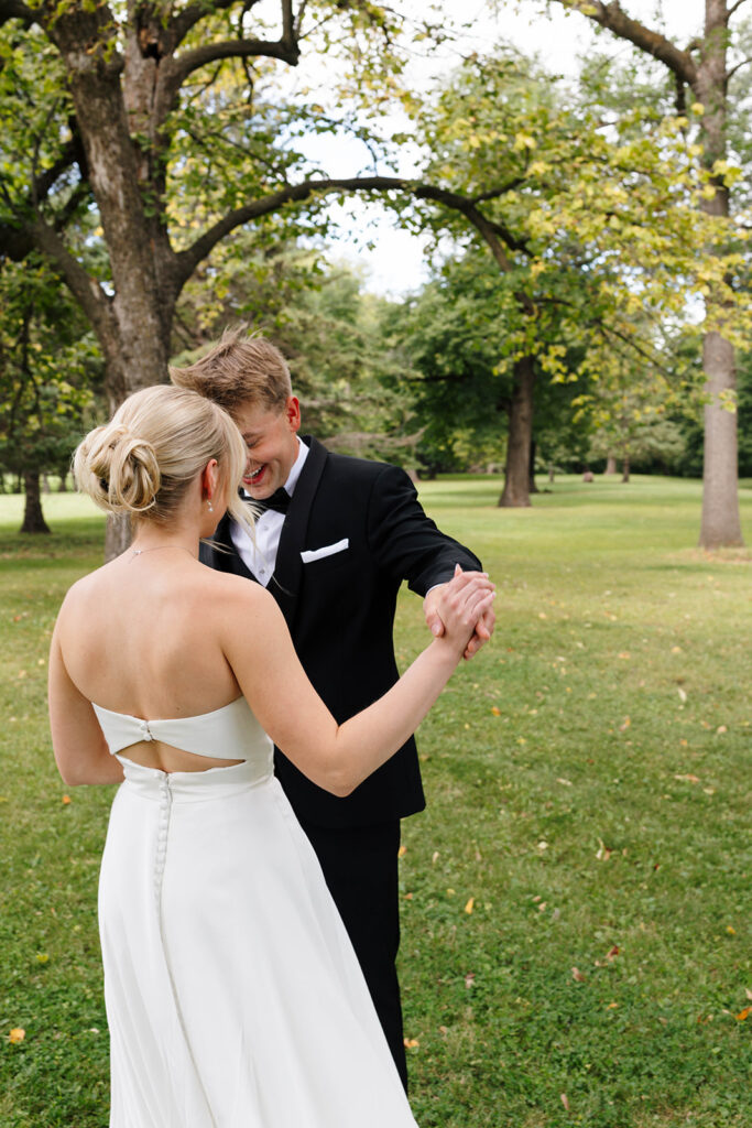 Bride and groom sharing their first look at a private estate wedding in North Dakota
