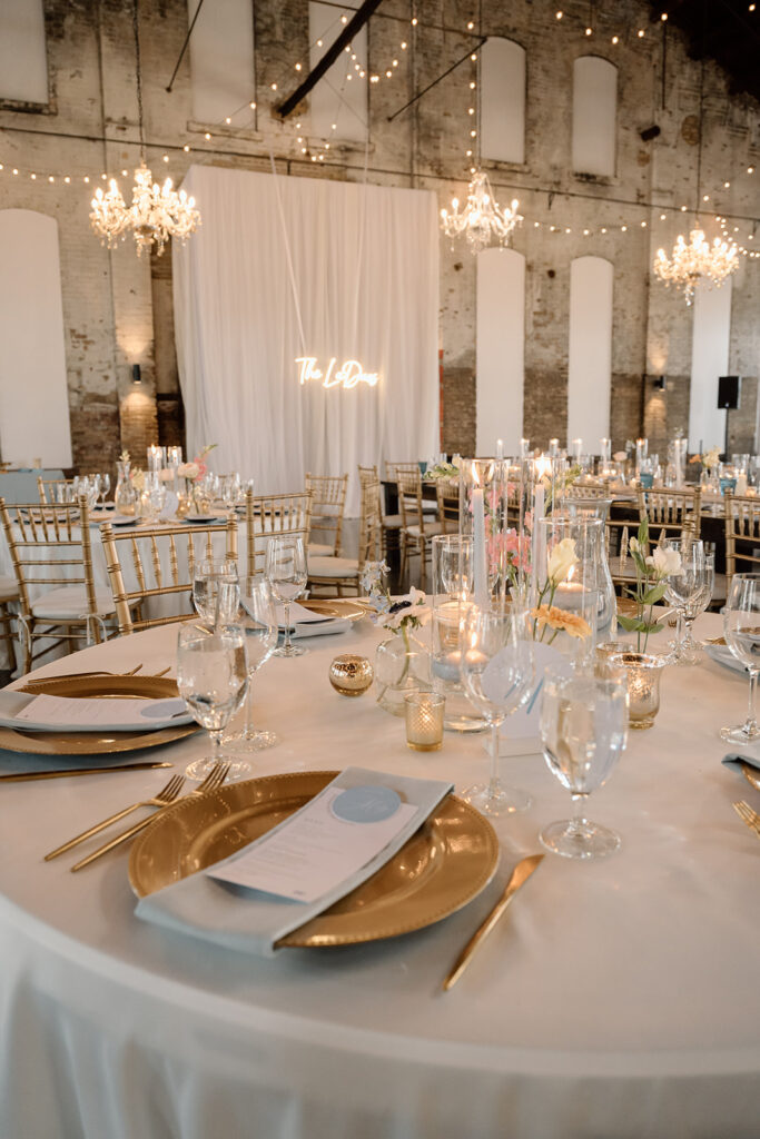 Elegant wedding reception setup inside The Northern Pacific Center with candles and florals
