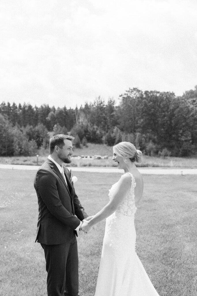 Bride and groom sharing a candid moment during their wedding day.
