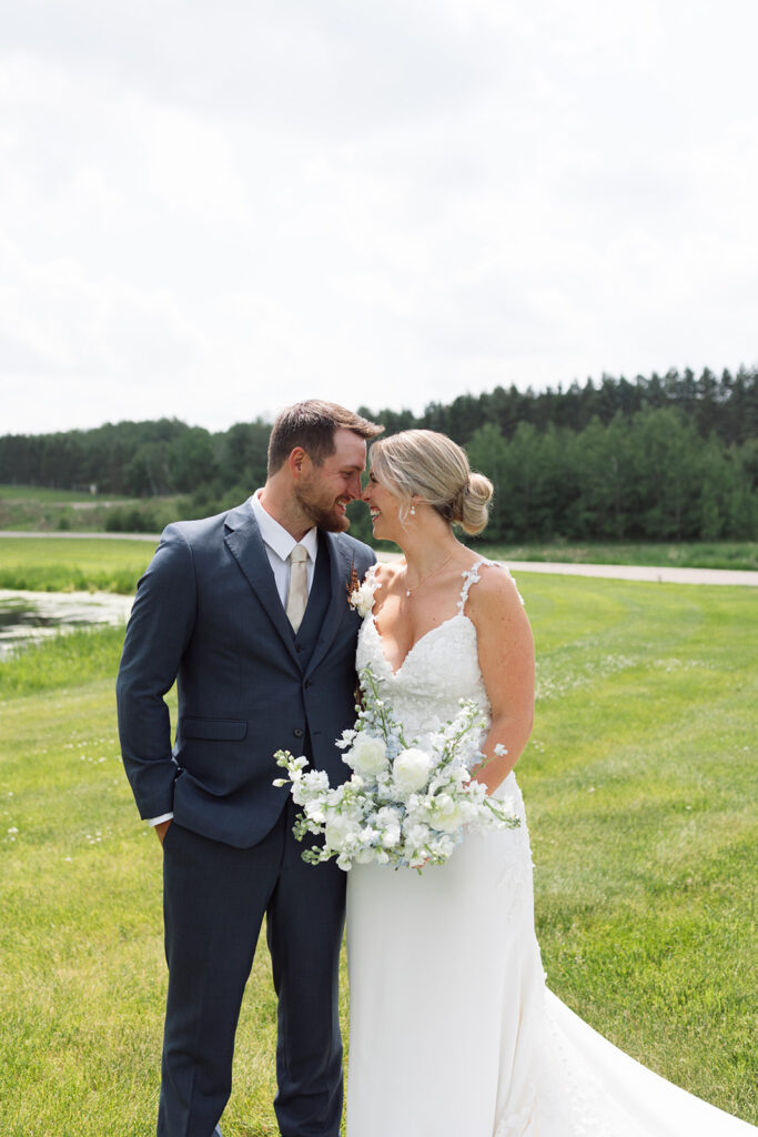 Bride and groom sharing a candid moment during their wedding day.
