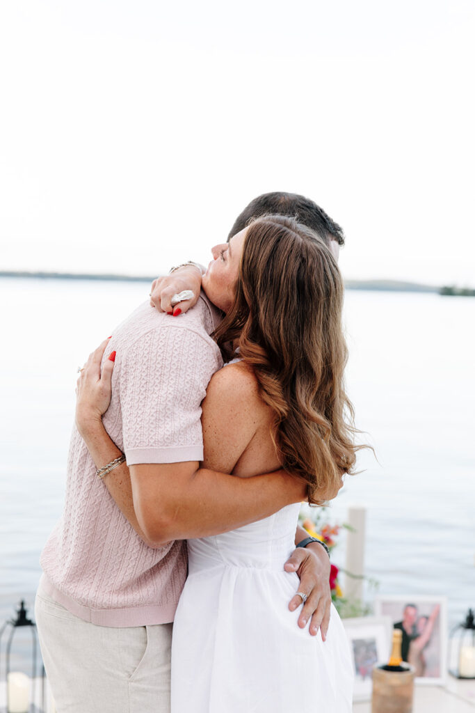 Natural light photo capturing a joyful engagement at crosslake chain.
