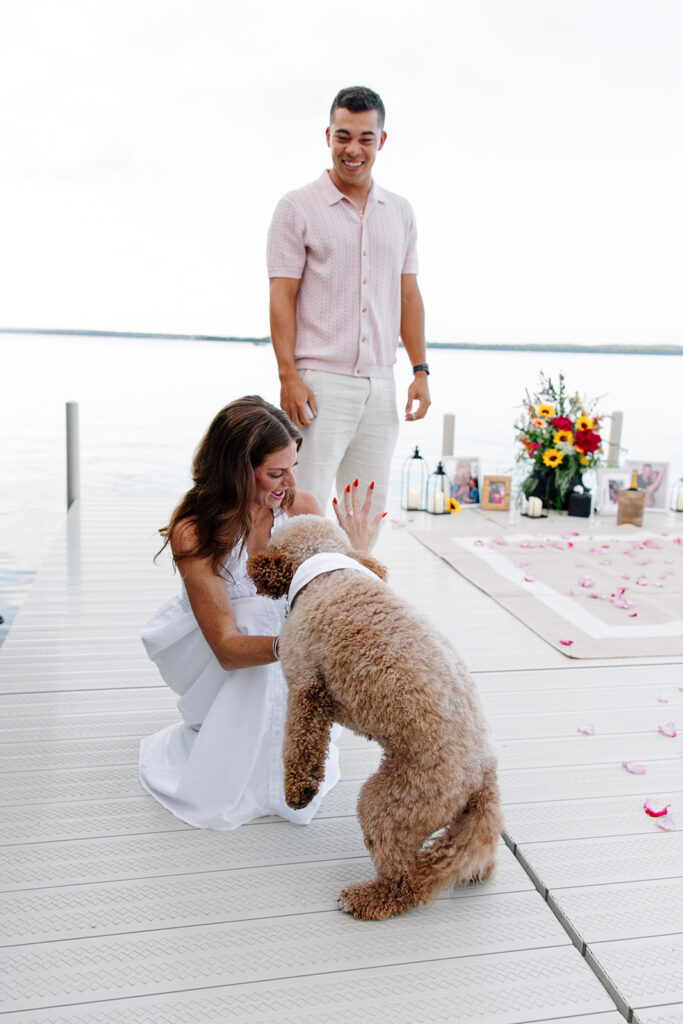 Natural light photo capturing a joyful engagement at crosslake chain.
