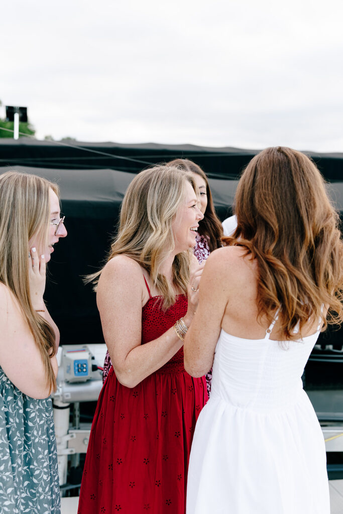 Natural light photo capturing a joyful engagement at crosslake chain.
