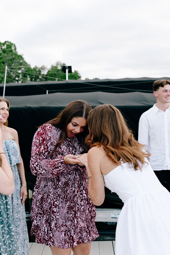Natural light photo capturing a joyful engagement at crosslake chain.
