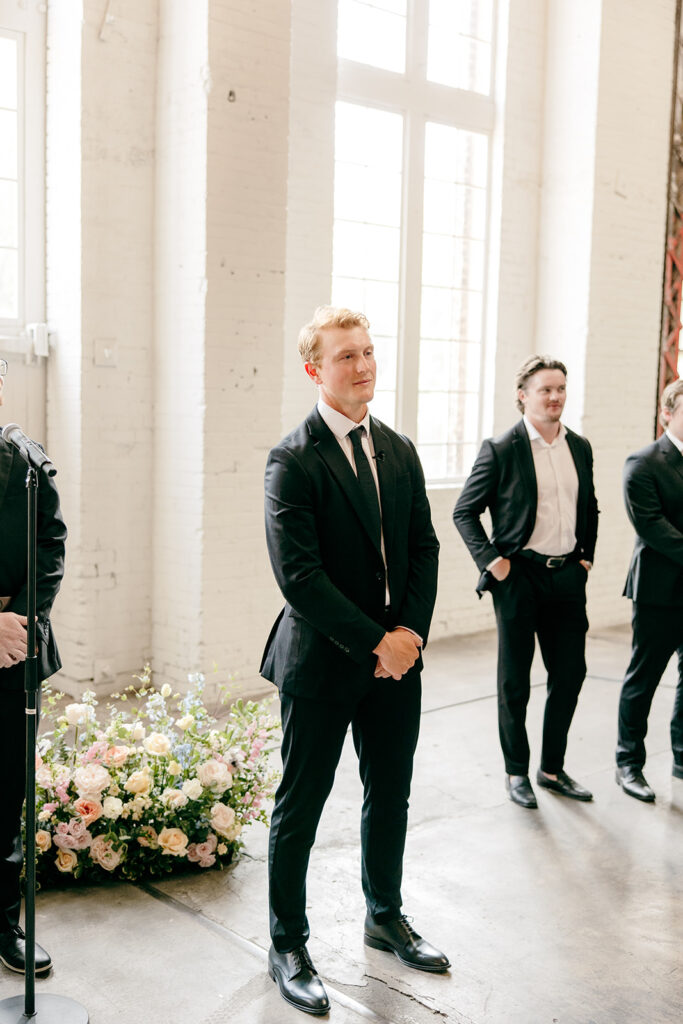 Elegant wedding ceremony setup inside The Northern Pacific Center with candles and florals
