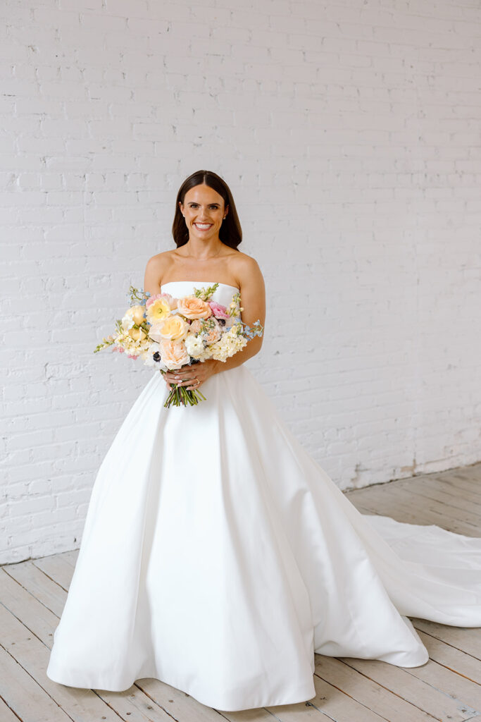 Bride and groom posing for timeless wedding portraits
