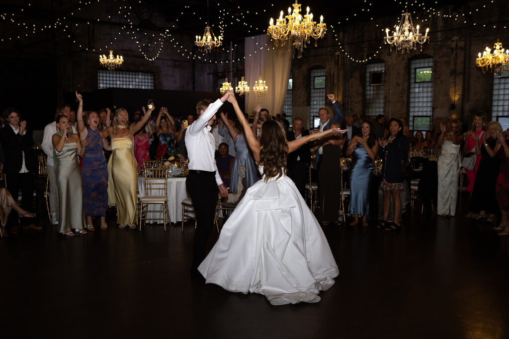 Guests dancing and celebrating during the lively wedding reception
