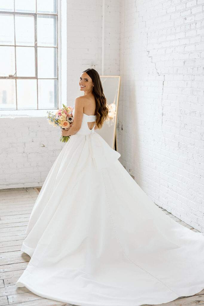 Bride and groom posing for timeless wedding portraits
